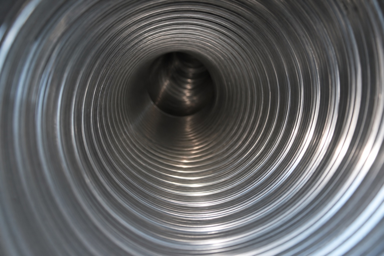 Clean metal dryer vent duct after professional cleaning with restored airflow